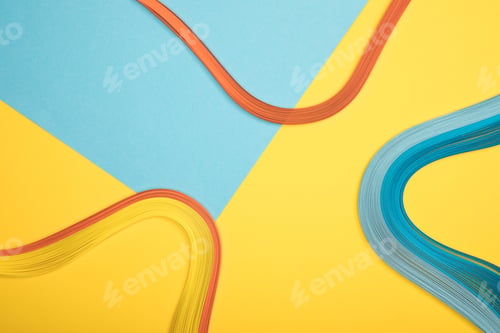 Preview: top view of curved multicolored lines on blue and yellow background