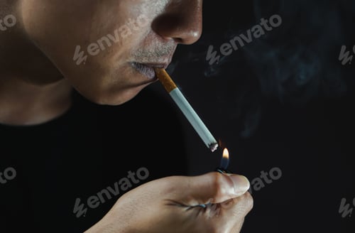 Preview: A man smoking cigarette in dark room