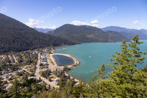 Preview: Small touristic town by the lake with Canadian Mountain Landscape