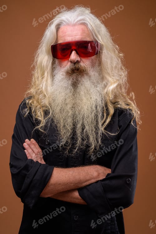Preview: Portrait of senior bearded man wearing red glasses