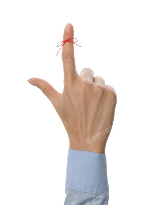 Preview: Woman showing index finger with tied red bow as reminder on white background, closeup