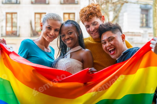 Preview: Lgtb couples of lesbian gay boys and girls in a portrait with rainbow flag
