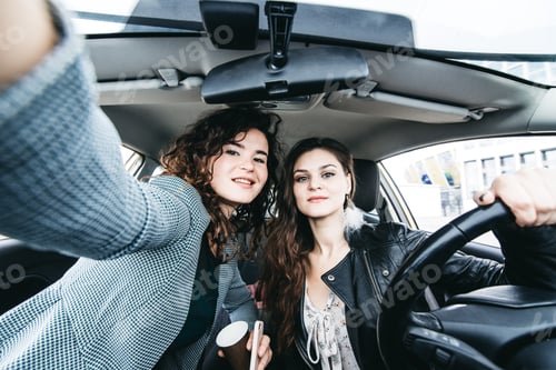 Preview: Two girls making selfie in a car