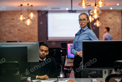 Preview: Digital Collaboration: Blonde Businesswoman and African American Partner Reviewing Documents Online