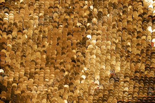 Preview: background of gold sequins. shiny sparkling background