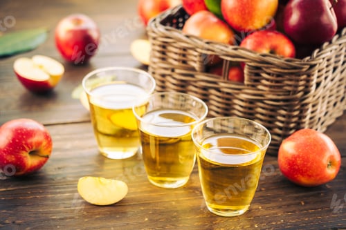 Preview: Apples juice in glass with apple in the basket