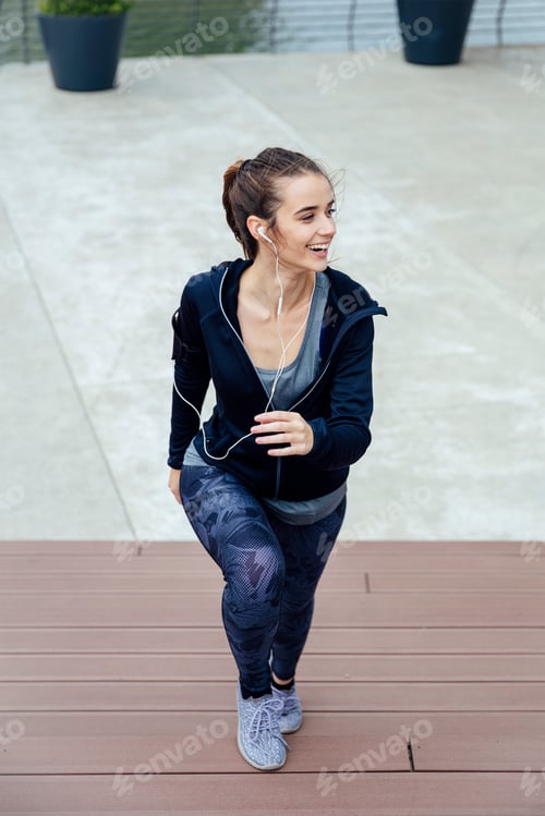 Preview: Woman running outdoor wearing sport clothes