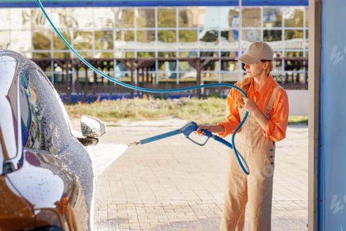 Preview: High pressure rinse at self service car wash with foam on vehicle