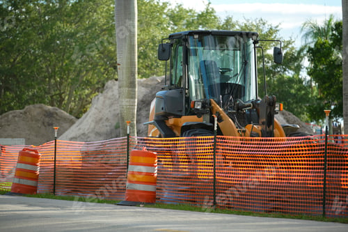 Preview: Protective restriction barrier at industrial construction site. Safety mesh fence for pedestrians