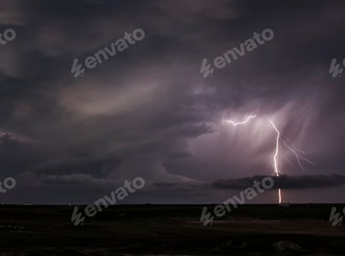 Preview: Lightning bolt striking under stormy skies.