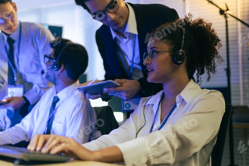 Preview: Professional team of diverse agents providing customer support in a modern tech office