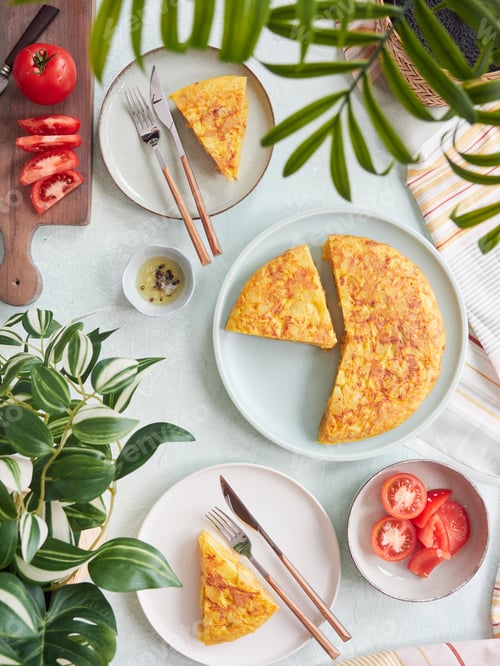 Preview: Delicious Spanish potato omelette served in portions on the table.
