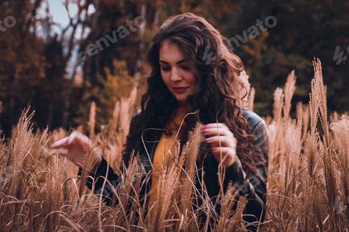 Preview: Woman Enjoys Nature, Surrounded by Golden Meadow