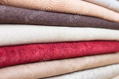 Preview: Stack of Colorful Fabrics in a Close-Up View