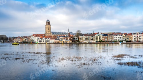 Preview: Scenic view of the town of Deventer along a river in the Netherlands