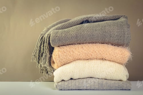 Preview: Stack of cozy knitted sweaters