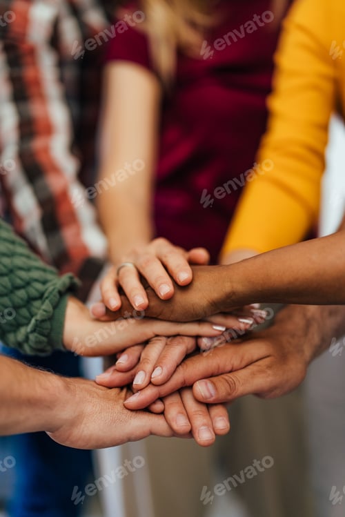 Preview: Group of Hands Stacked Together Demonstrating Team Unity and Diversity