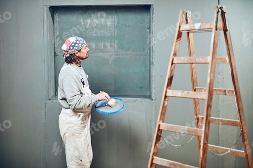 Preview: Painter Painting Walls With A Paintbrush Indoors.