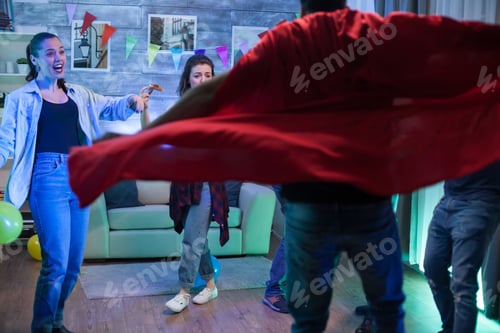 Preview: Young man with a red superhero cape