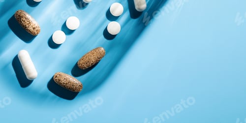 Preview: Various vitamins, tablets and dietary supplements on a blue background. Medicine. Copy space