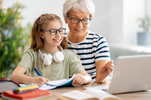 Preview: Girl doing homework or online education.