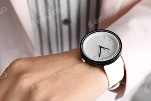 Preview: Businesswoman with stylish wrist watch, closeup. Time management