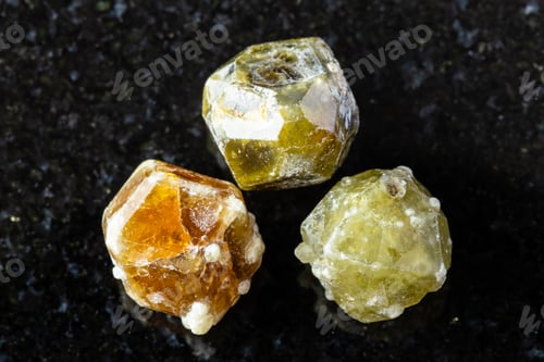 Preview: sample of few grossular garnet crystals on black