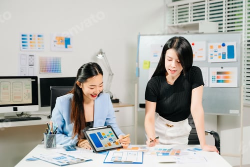 Preview: UX UI designers collaborating on mobile app wireframes, showcasing teamwork, creative planning,