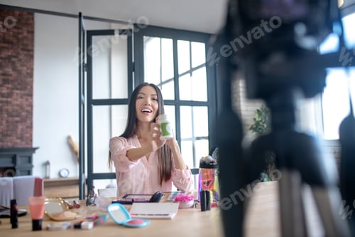 Preview: Appealing woman giving recommendation of vitamins to her followers