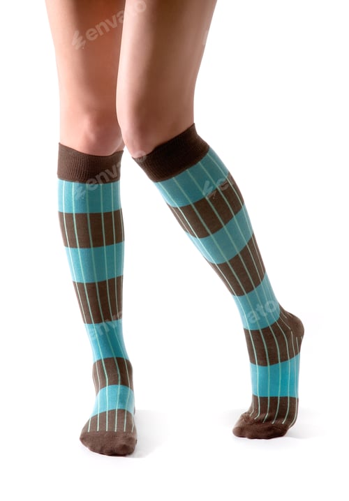 Preview: Young woman legs posing with turquoise striped socks