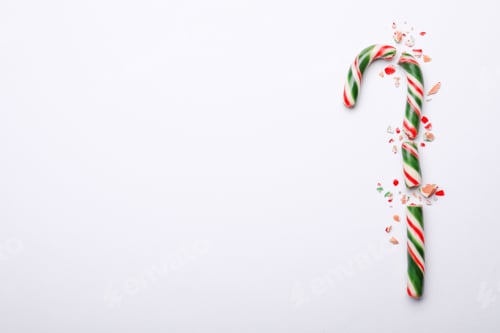 Preview: Broken sweet Christmas candy cane on white background, top view. Space for text
