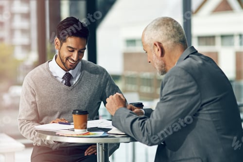 Preview: Talking business. Cropped shot of two businessmen talking in their office.