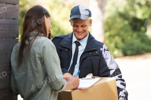 Preview: She likes his package. Shot of a courier delivering a package to a young woman.