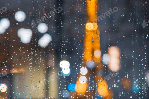 Preview: Blurred Eiffel Tower Silhouette Behind a Rain Dropped Window During Night