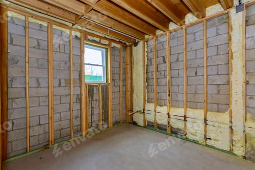 Preview: House in unfinished under construction in insulation foam the wall of a basement