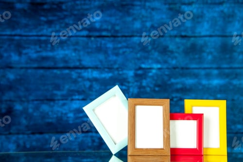 Preview: front view picture frames with colored corners on blue background present picture memory photo