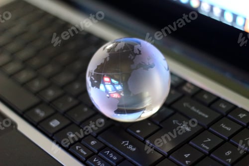 Global Technology Glass Orb on Laptop Keyboard