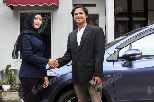 Preview: Salesman shaking hands with woman client