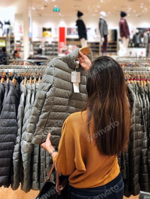 Preview: Women shopping coat winter at mall