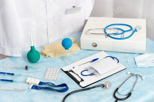 Preview: Medical Supplies and Instruments on Blue Surface