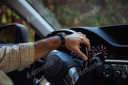 Preview: middle aged man driving a car