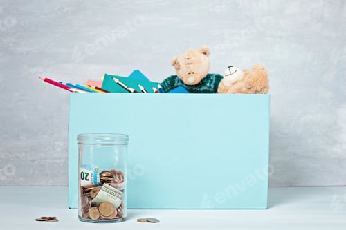 Preview: Coins, banknotes in money jar and box with donations