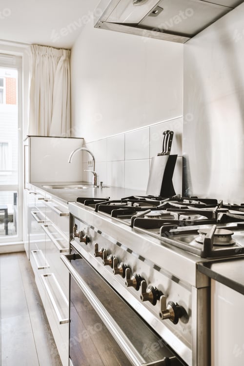Preview: a kitchen with a stove top oven and a sink