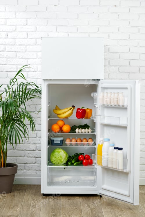 Preview: White Refrigerator Open With Fresh Produce and Dairy