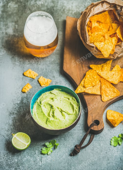 Preview: Mexican corn chips, fresh guacamole sauce and glass of beer