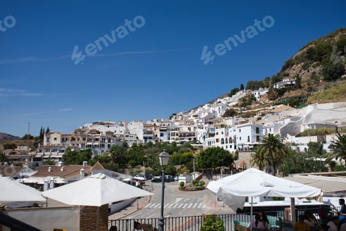 Preview: Buildings and tourists having tapas.