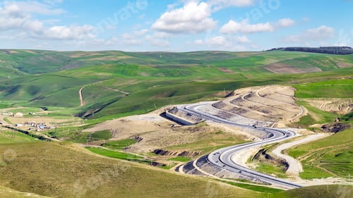 Preview: A winding road through a mountain pass