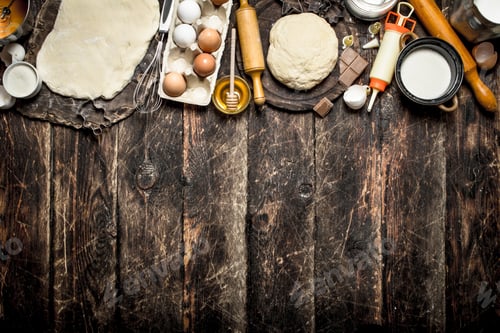 Preview: Dough background. Fresh dough with various ingredients on a wooden table.