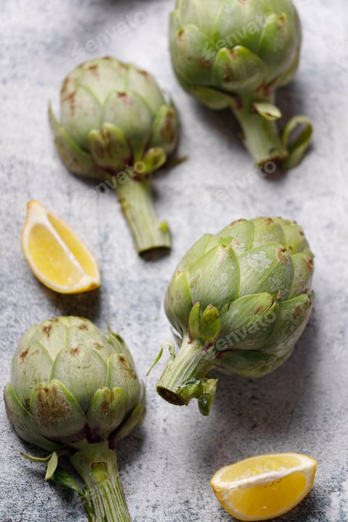 Preview: fresh artichokes on rustic gray background