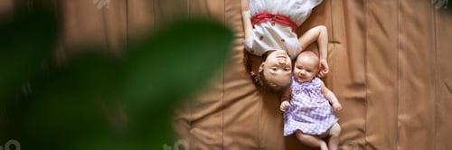 Preview: Sisters Lying on Bed, Wide Banner with Copy Space